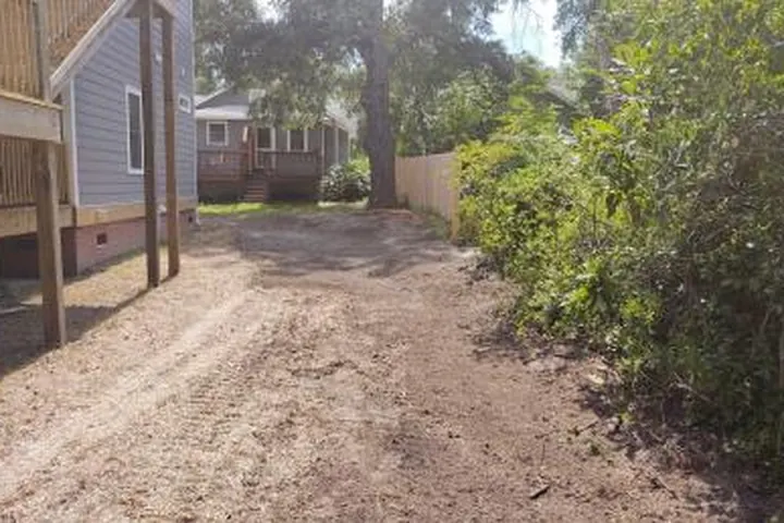 Land clearing equipment preparing a wooded property