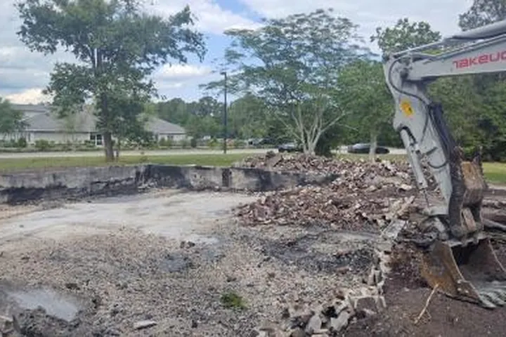Excavation site work with utility and drainage preparation